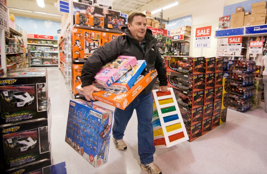 Bargain shopping is common in the holiday season, but parents are advised to buy the kids fewer toys so they will have time to play and appreciate thir gifts. (Craig Bisacre/The Washington Times)