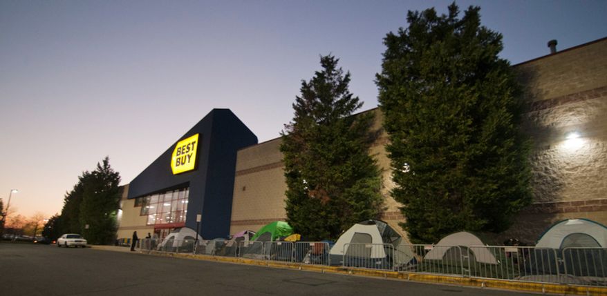 Shoppers wait in line to be let into Best Buy on Thanksgiving Day, Fairfax, Va., Thursday, November 22, 2012. One family had been waiting in line since Wednesday afternoon to be the first costumer. (Craig Bisacre/The Washington Times)
