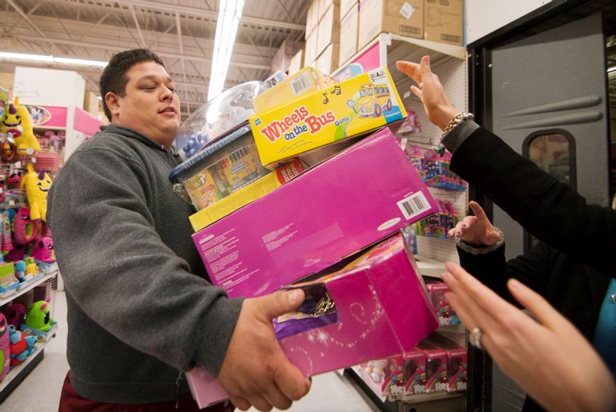 Shoppers look for bargains at Toys'R'Us on Thanksgiving Day, Fairfax, Va., Thursday, November 22, 2012. The stores, which opened nationwide at 8PM, will remain open for 24 hours for Black Friday. (Craig Bisacre/The Washington Times)