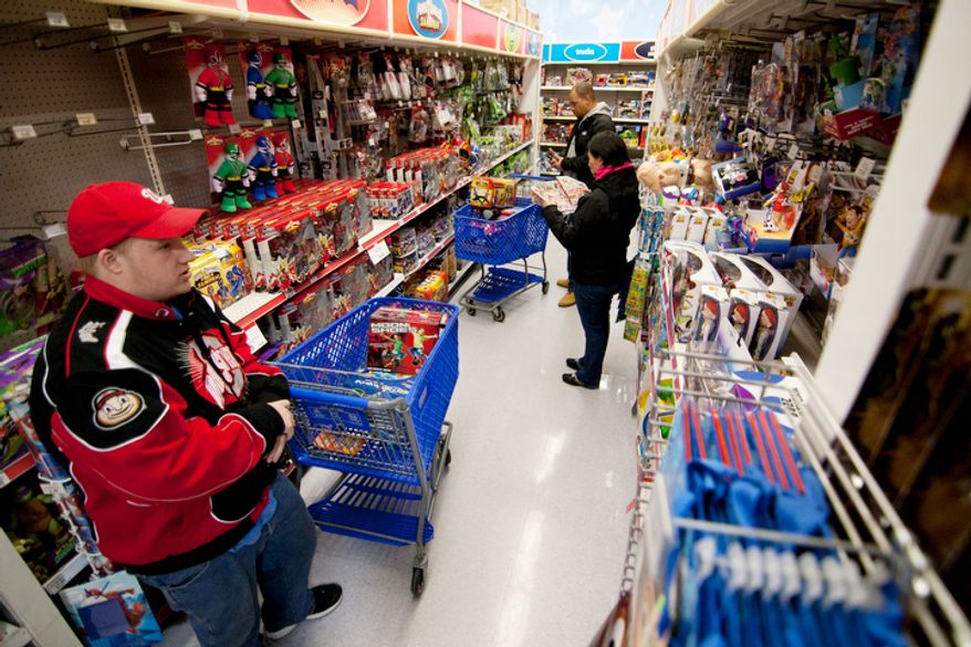 Shoppers look for bargains at the Toys 'R' Us store in Fairfax, Va., on Thanksgiving Day, Thursday, Nov. 22, 2012. (Craig Bisacre/The Washington Times)