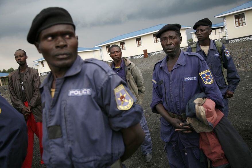 Congolese policemen gather at the Mugunga police training center near the eastern Congolese town of Goma on Nov. 23, 2012. The officers were called by M23 rebel officials to receive an ideological briefing. Platoons of rebels were making their way across the hills from Sake to the next major town of Minova, where the Congolese army was believed to be regrouping. The militants seeking to overthrow the government vowed to push forward despite mounting international pressure. (Associated Press)