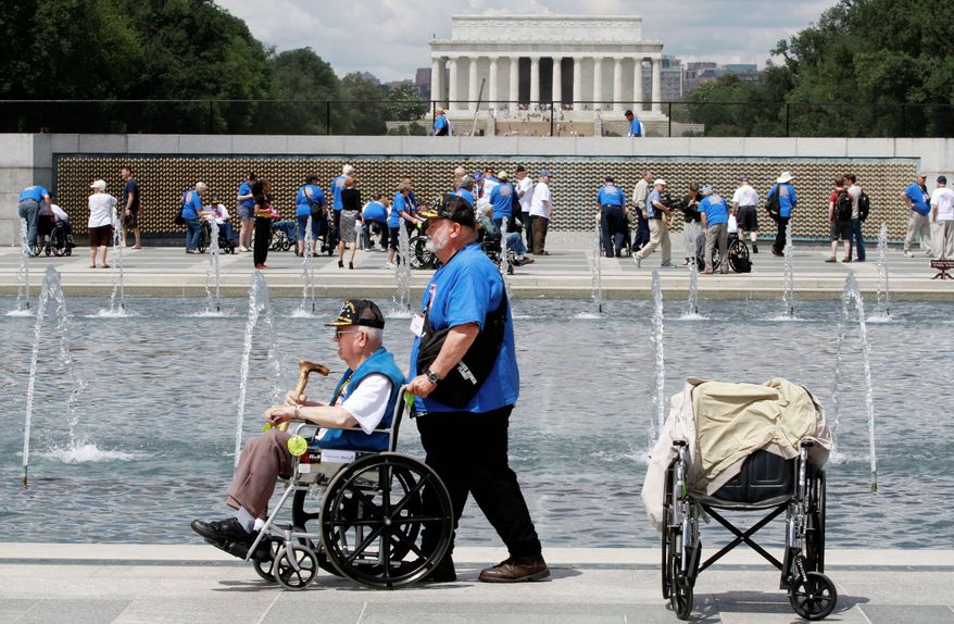 Marvin Kincaid, 85, of Thayer, Mo., a private in the Army infantry during World War II, made it to the World War II Memorial in June as honor flight veterans visited on the 68th anniversary of D-Day. As many as 100 veterans of the war missed their chance to travel to D.C. after money disappeared from a Kansas nonprofit that organized free trips for them. (Associated Press)