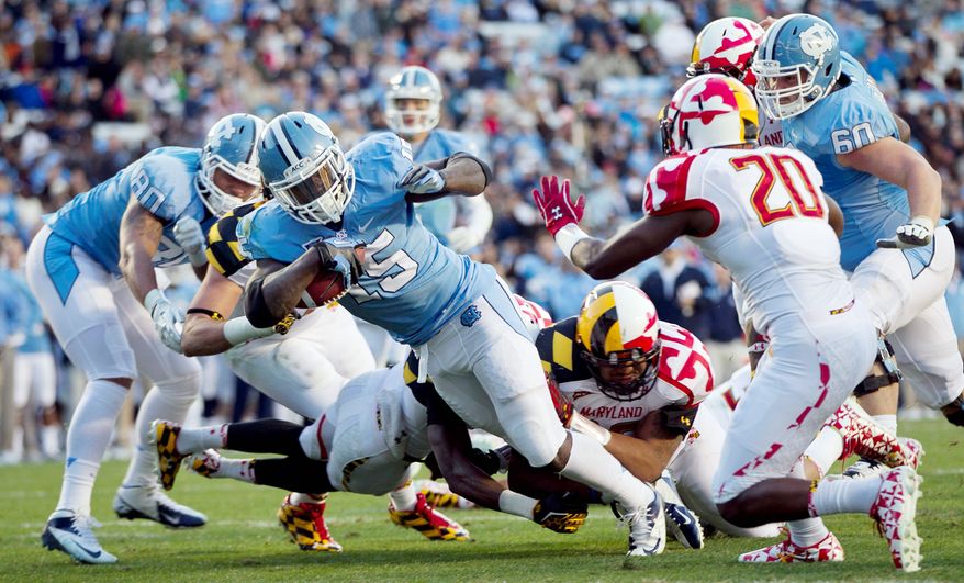 Maryland was game, but North Carolina, shown getting a second-quarter touchdown from A.J. Blue, proved too much as the Terrapins lost their season finale. (Associated Press)