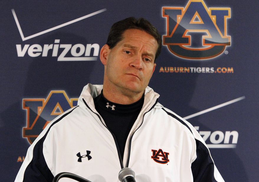 Auburn coach Gene Chizik talks to the media after a loss to Alabama 49-0 in an NCAA college football game on Saturday, Nov. 24, 2012, in Tuscaloosa, Ala. Chizik would not answer questions about his future at Auburn. (AP Photo/Butch Dill)
