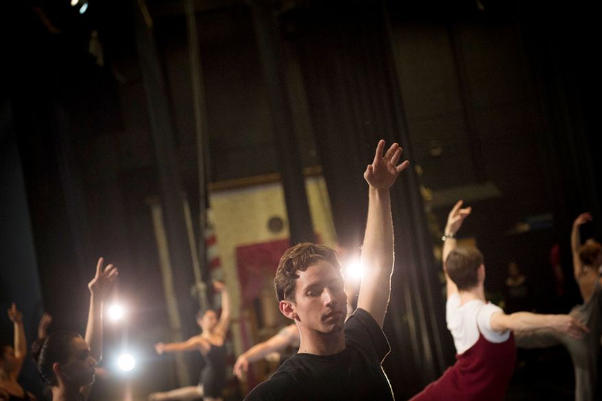 Dancer Nolan Seda, with the City of San Diego Ballet, warms up on stage prior to their performance of The Nutcracker at W.T. Woodson High School in Fairfax, Va., Sunday, Nov. 25, 2012. (Rod Lamkey Jr./The Washington Times)