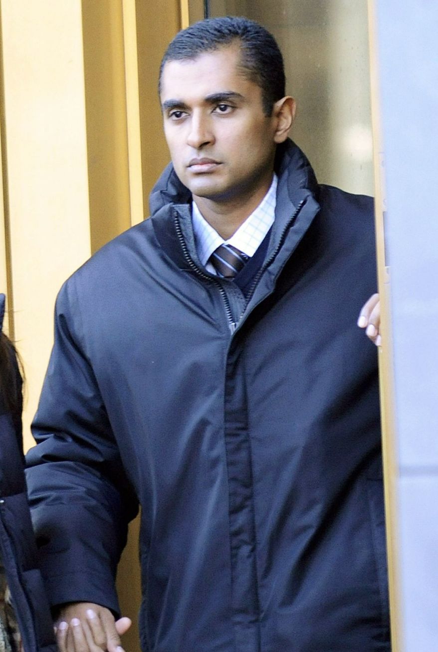 Mathew Martoma, former SAC Capital Advisors hedge fund portfolio manager, exits court in New York on Monday. Mr. Martoma was released on $5 million bail after his 12-minute appearance before a federal magistrate judge. His movements were restricted. (Associated Press)