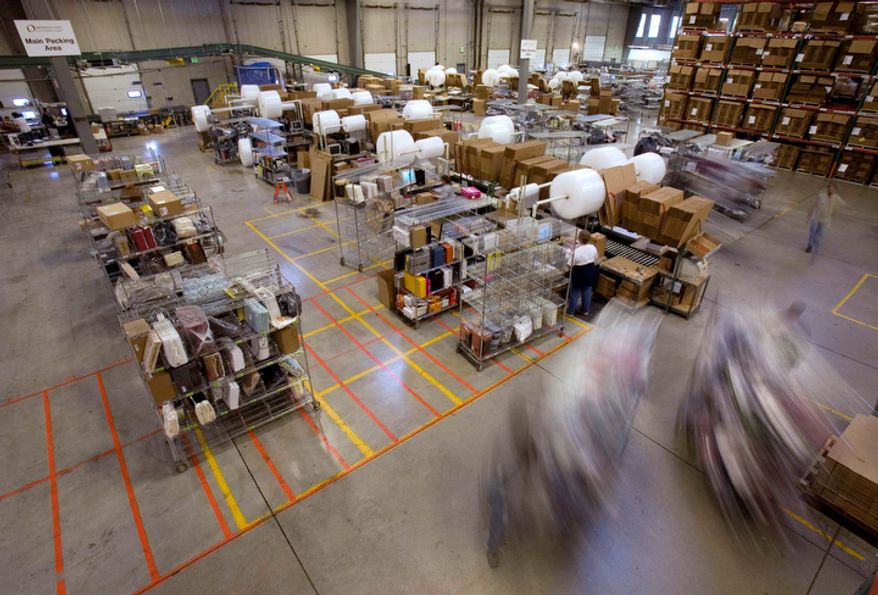 Carts full of merchandise ordered online are rolled to the main packing area for shipping at the Overstock.com warehouse in Salt Lake City on Friday, Nov. 29, 2008. "Cyber Monday," coined in 2005 by a shopping trade group that noticed a spike in online sales on the Monday after Thanksgiving when people returned to their work computers, is the next in a line of days that stores are counting on to jump-start the holiday shopping season. This year it is expected to be the biggest online shopping day of the year for the third year in a row. (AP Photo/Douglas C. Pizac)