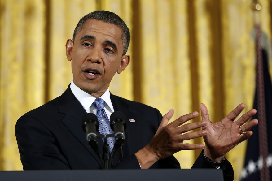 President Obama gestures as he answers a question during a news conference in the East Room of the White House in Washington on Wednesday, Nov. 14, 2012. (AP Photo/Carolyn Kaster)