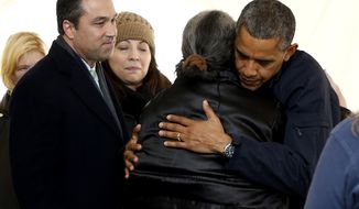 Rep. Michael G. Grimm (left) joins President Obama on a visit to the FEMA recovery center on the grounds of New Dorp High School on Thursday, Nov. 15, 2012, in the New York borough of Staten Island. (AP Photo/Carolyn Kaster)