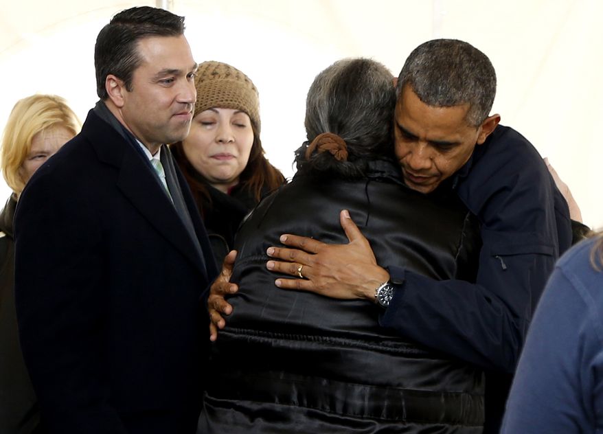 Rep. Michael G. Grimm (left) joins President Obama on a visit to the FEMA recovery center on the grounds of New Dorp High School on Thursday, Nov. 15, 2012, in the New York borough of Staten Island. (AP Photo/Carolyn Kaster)
