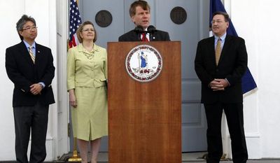 Virginia Gov. Robert F. McDonnell (at podium) addresses President Obama&#39;s announcement of offshore oil and gas exploration as (from left) Virginia Secretary of Commerce and Trade Jim Cheng, Deputy Secretary of Natural Resources Maureen Matsen and Secretary of Natural Resources Dout Domenech look on at the Capitol in Richmond on Wednesday, March 31, 2010. (AP Photo/Richmond Times-Dispatch, Bob Brown)