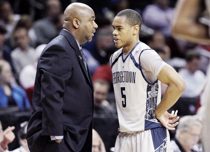 Georgetown coach John Thomson III talks strategy with guard Markel Starks, who enjoys the up-tempo approach, as does wingman Greg Whittington. The Hoyas are averaging 68.6 possessions a game. (Associated Press)