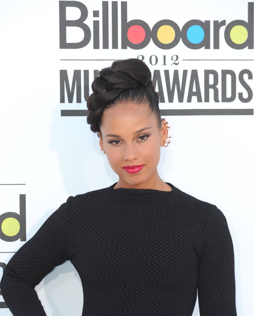 In this photo provided by the Las Vegas News Bureau, singer Alicia Keys walks the red for the 2012 Billboard Music Awards at the MGM Grand on the Las Vegas Strip. Sunday, May 20, 2012. (AP Photo/Las Vegas News Bureau, Glenn Pinkerton)