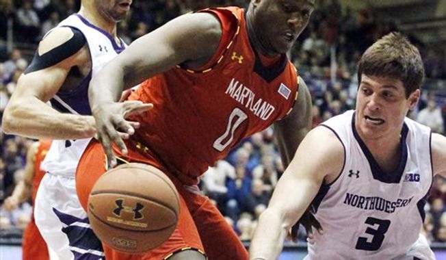 Northwestern guard Dave Sobolewski (3) knocks the ball out of the hands of Maryland forward Charles Mitchell (0) as Northwestern forward Drew Crawford defends during the first half of an NCAA basketball game, Tuesday, Nov. 27, 2012, in Evanston, Ill. (AP Photo/Charles Rex Arbogast)