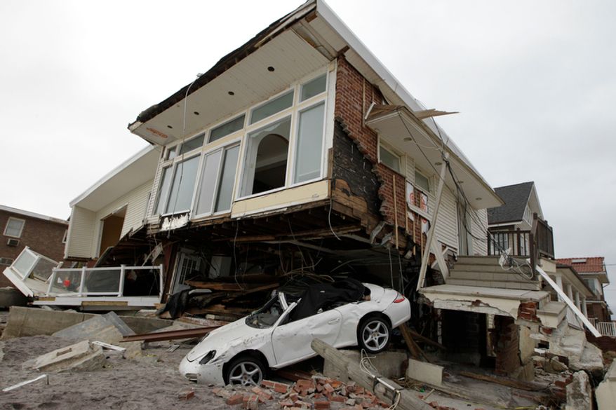 A beachside house, deemed uninhabitable by the New York City Department of Buildings, is left in ruins in the Belle Harbor neighborhood of the Rockaways in the New York borough of Queens on Monday, Nov. 19, 2012. (AP Photo/Kathy Willens)