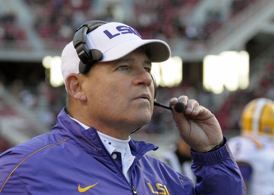 LSU coach Les Miles watches during NCAA college football game against Arkansas in Fayetteville, Ark., Friday, Nov. 23, 2012. LSU won 20-13. (AP Photo/David Quinn)