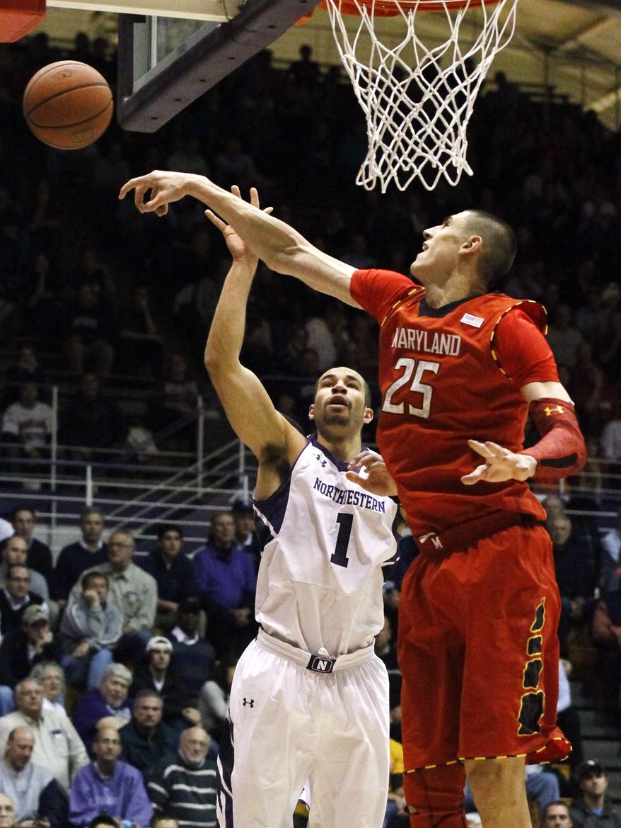 Maryland center Alex Len (25) blocks the shot of Northwestern forward Drew Crawford during the second half of an NCAA college basketball game, Tuesday, Nov. 27, 2012, in Evanston, Ill. Maryland won 77-57. (AP Photo/Charles Rex Arbogast)