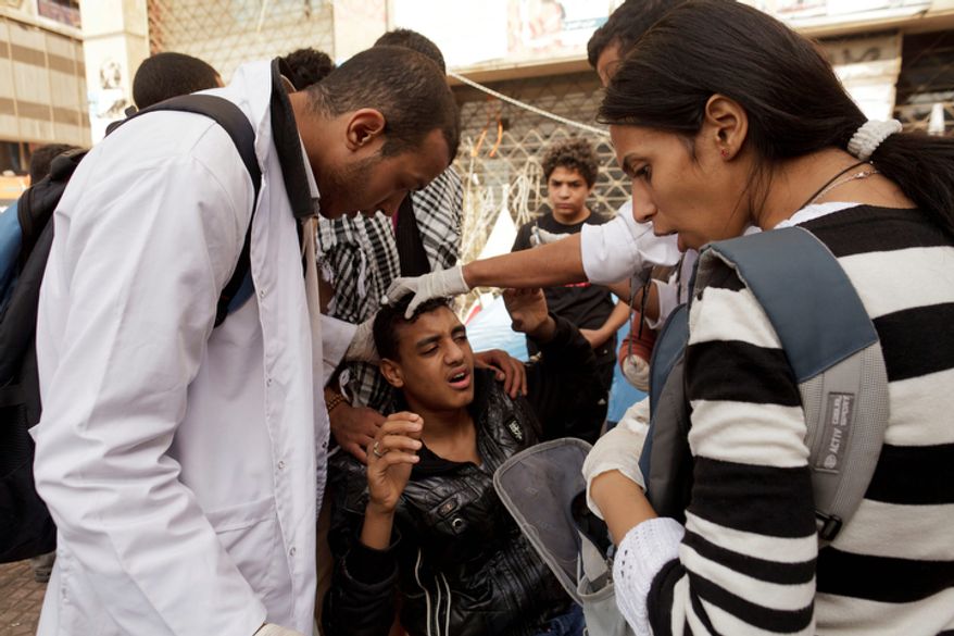 An Egyptian protester is treated at a field hospital in Tahrir Square in Cairo for wounds sustained during clashes with security forces on Thursday, Nov. 29, 2012. (AP Photo/Maya Alleruzzo)