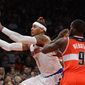 New York Knicks&#39; Carmelo Anthony, left, and Washington Wizards&#39; Martell Webster chase a loose ball in the first quarter of an NBA basketball game at Madison Square Garden in New York, Friday, Nov. 30, 2012. (AP Photo/Henny Ray Abrams)