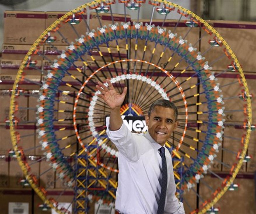 President Barack Obama waves after speaking at the Rodon Group, which manufactures over 95% of the parts for K'NEX Brands toys, Friday, Nov. 30, 2012, in Hatfield, Pa. The visit comes as the White House continues a week of public outreach efforts, while also attempting to negotiate a deal with congressional leaders. (AP Photo/The Philadelphia Inquirer, Michael S. Wirtz)