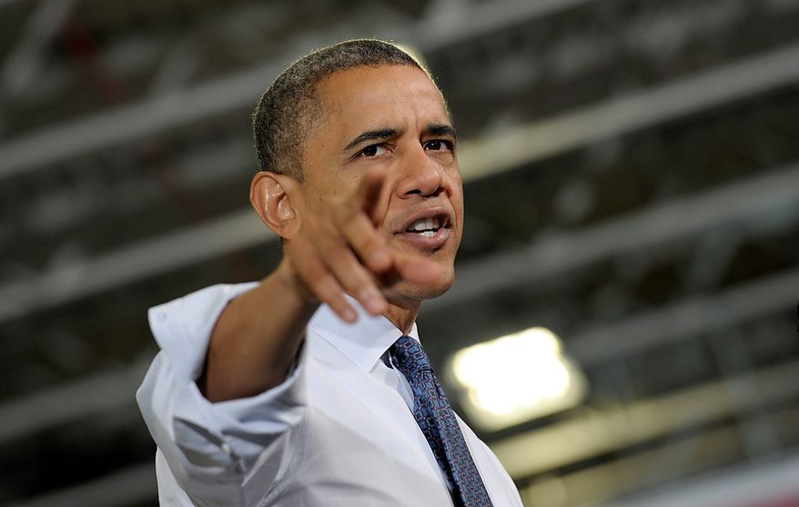 President Obama gestures as he speaks at the Rodon Group, which manufactures more than 95 percent of the parts for K'NEX Brands toys, on Friday, Nov. 30, 2012, in Hatfield, Pa. The visit cames as the White House continued a week of public outreach efforts while attempting to negotiate a budget deal with congressional leaders. (AP Photo/Susan Walsh)