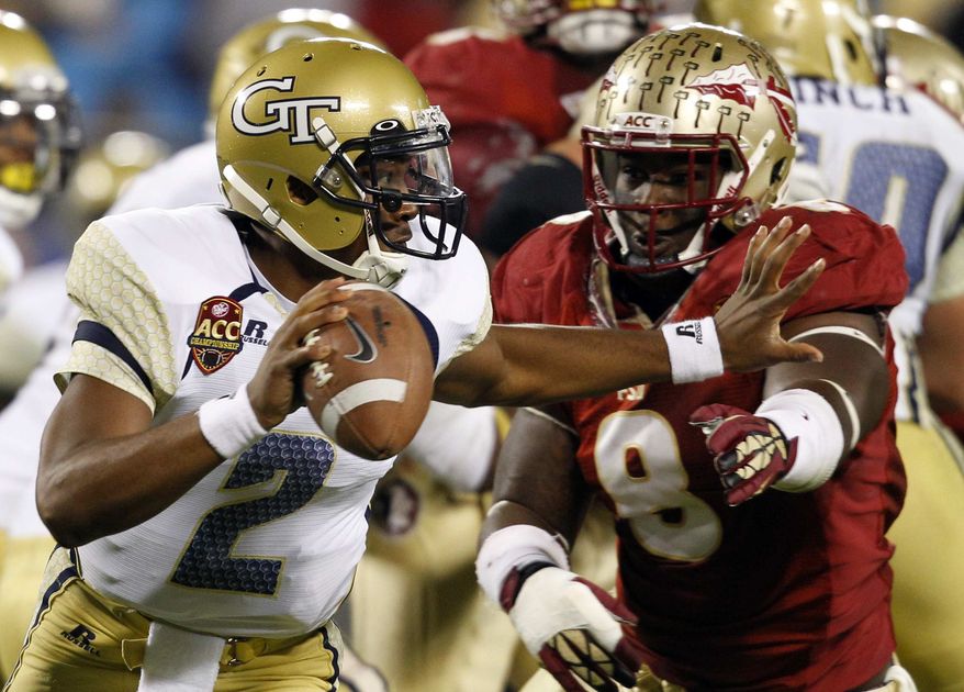 Georgia Tech's Vad Lee (2) tries to scrambles away from Florida State's Timmy Jernigan (8) during the first half of the ACC Championship college football game in Charlotte, N.C., Saturday, Dec. 1, 2012. Lee was sacked on the play. (AP Photo/Chuck Burton)