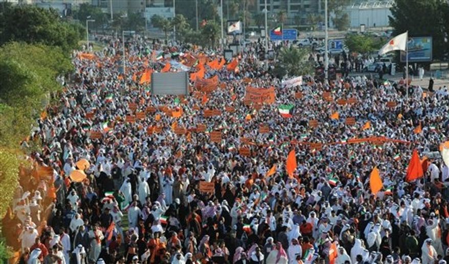 Islamist, nationalist and liberal opposition groups gather to protest the Kuwait government's amendment of the electoral law and support a boycott on the country's election on Friday, Nov. 30, 2012, in Kuwait City. (AP Photo/Gustavo Ferrari)