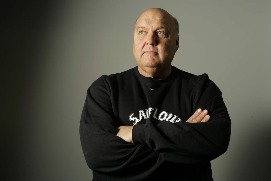 ** FILE ** In this Oct. 30, 2007, file photo, St. Louis basketball coach Rick Majerus poses for a photo in St. Louis. Majerus, the jovial college basketball coach who led Utah to the 1998 NCAA final and had only one losing season in 25 years with four schools, died Saturday, Dec. 1, 2012. He was 64. (AP Photo/Jeff Roberson, File)