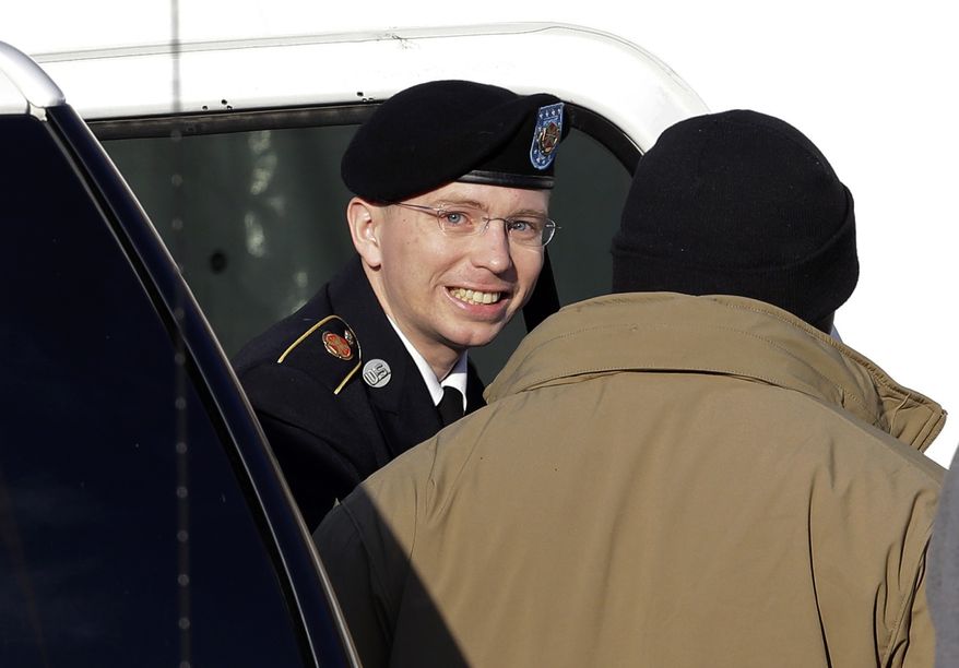 ** FILE ** Army Pfc. Bradley Manning (center) steps out of a security vehicle as he is escorted into a courthouse at Fort Meade, Md., for a pretrial hearing on Wednesday, Nov. 28, 2012. (AP Photo/Patrick Semansky)