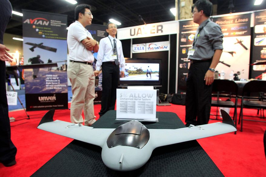 A vehicle from the Swallow Unmanned Aerial System was displayed at the Unmanned Vehicle Systems International convention in Las Vegas this year. Media, agriculture and real estate industries are expected to be among the most eager customers for drones. (Sam Morris/Special to The Washington Times)