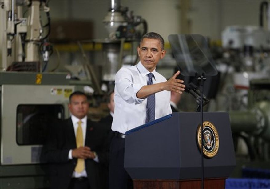President Obama gestures as he speaks at The Rodon Group manufacturing facility, Friday, Nov. 30, 2012, in Hatfield, Pa. Obama spoke at the toy company about how middle class Americans would see their taxes go up if Congress fails to act to extend the middle class tax cuts. (AP Photo/The Philadelphia Inquirer, Michael S. Wirtz)