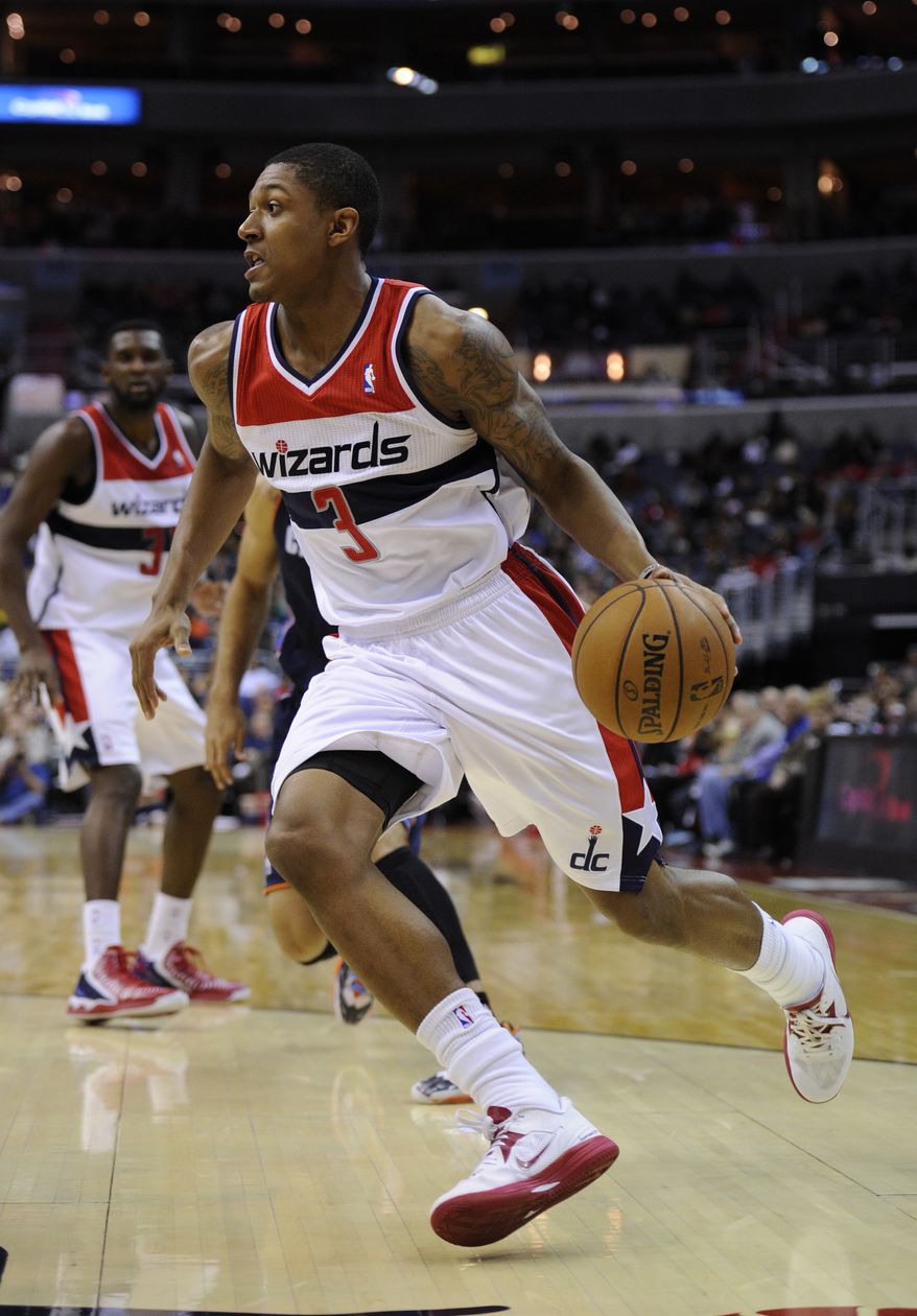 Washington Wizards shooting guard Bradley Beal (3) dribbles against the Charlotte Bobcats during the second half of an NBA basketball game, Saturday, Nov. 24, 2012, in Washington. Charlotte won 108-106 in double overtime. (AP Photo/Nick Wass)