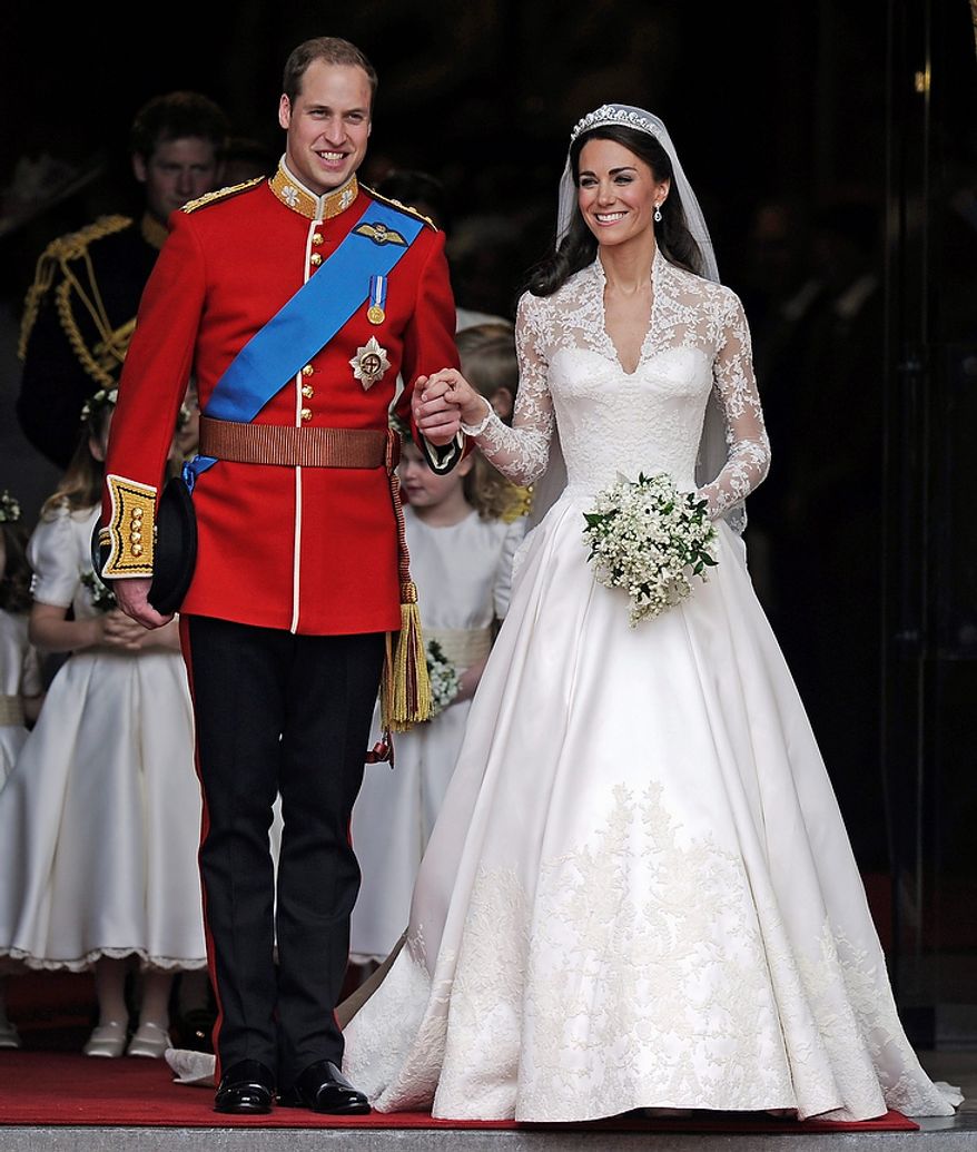 **FILE** Britain's Prince William and his bride Kate, Duchess of Cambridge, leave Westminster Abbey in London on April 29, 2011, following their wedding. (Associated Press)
