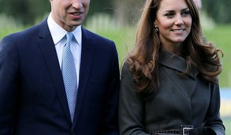 **FILE** Britain&#39;s Prince William (left) and his wife Kate, the Duchess of Cambridge, visit a football training pitch at St. George&#39;s Park near Burton Upon Trent in Staffordshire, England, on Oct. 9, 2012. (Associated Press)