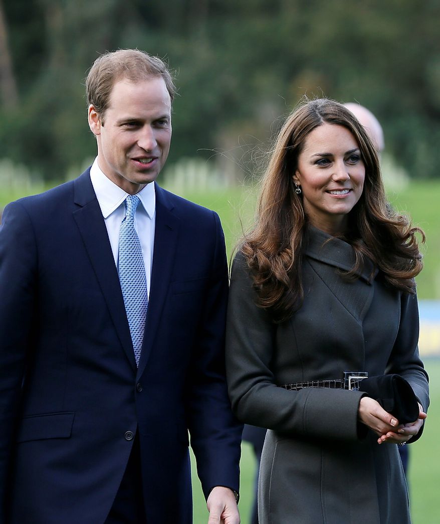 **FILE** Britain's Prince William (left) and his wife Kate, the Duchess of Cambridge, visit a football training pitch at St. George's Park near Burton Upon Trent in Staffordshire, England, on Oct. 9, 2012. (Associated Press)
