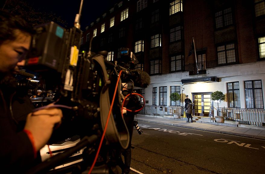 Members of the media position themselves as a policeman stands guard Dec. 3, 2012, outside the King Edward VII hospital in London, where the Duchess of Cambridge has been admitted with a severe form of morning sickness. Prince William and his wife Kate are expecting their first child. (Associated Press)