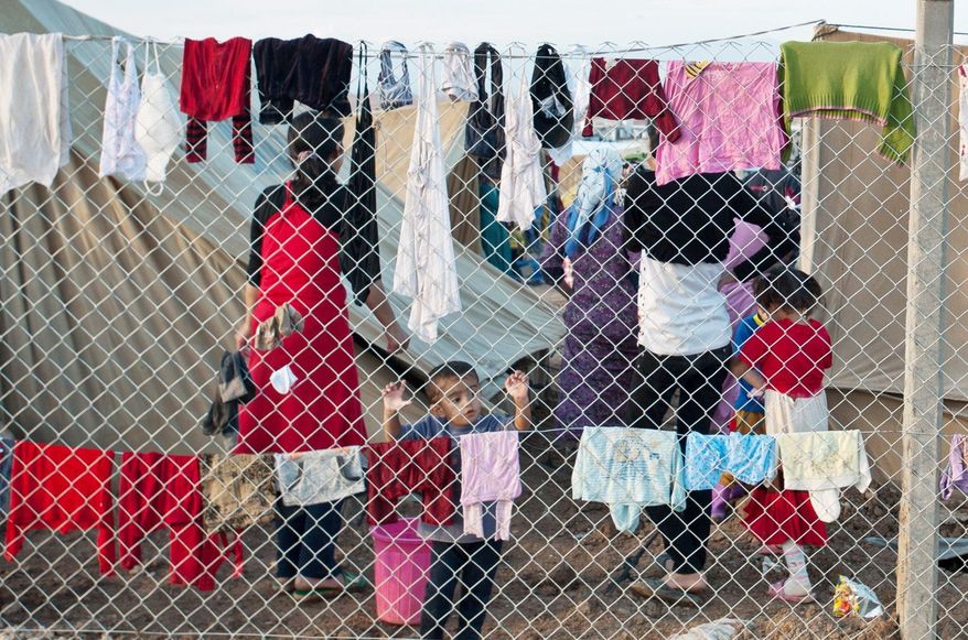 Though living conditions are rough, the refugees find peace and enjoy sharing their ancient language and culture. (Giulio Petrocco/ Special to The Washington Times)