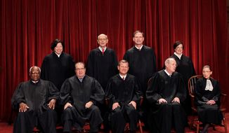 **FILE** This photo shows the justices of the U.S. Supreme Court in a group portrait at the Supreme Court Building in Washington on Oct. 8, 2010. Seated from left to right are: Associate Justice Clarence Thomas, Associate Justice Antonin Scalia, Chief Justice John G. Roberts, Associate Justice Anthony M. Kennedy, Associate Justice Ruth Bader Ginsburg. Standing, from left are: Associate Justice Sonia Sotomayor, Associate Justice Stephen Breyer, Associate Justice Samuel Alito Jr., and Associate Justice Elena Kagan. (Associated Press)
