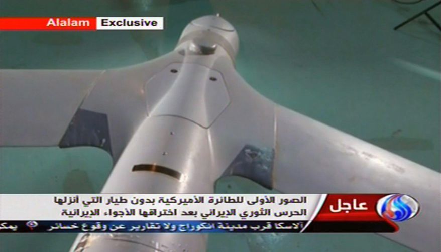 An image taken from Iranian state TV's Arabic-language channel, Al-Alam, shows what Tehran purports is an intact U.S. ScanEagle drone aircraft on Tuesday, Dec. 4, 2012. (AP Photo/Al-Alam TV)