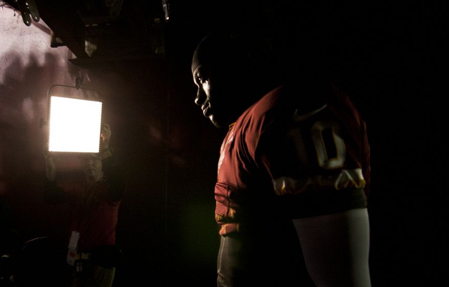 Washington Redskins quarterback Robert Griffin III (10) takes the field against the New York Giants, Landover, Md., Monday, Dec. 3, 2012. (Craig Bisacre/The Washington Times)