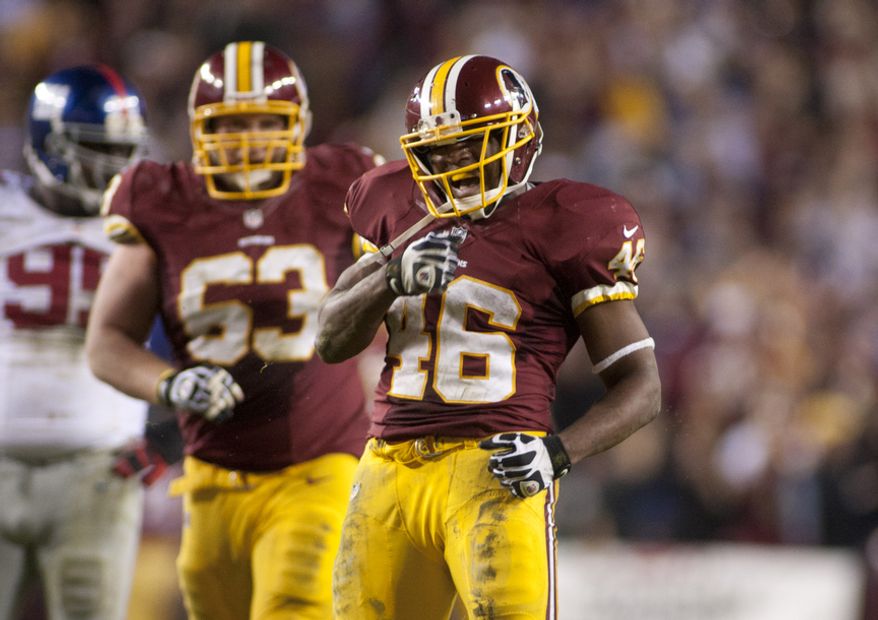 Washington Redskins running back Alfred Morris (46) celebrates after getting the first down in the final seconds against the New York Giants, Landover, Md., Monday, Dec. 3, 2012. (Craig Bisacre/The Washington Times)