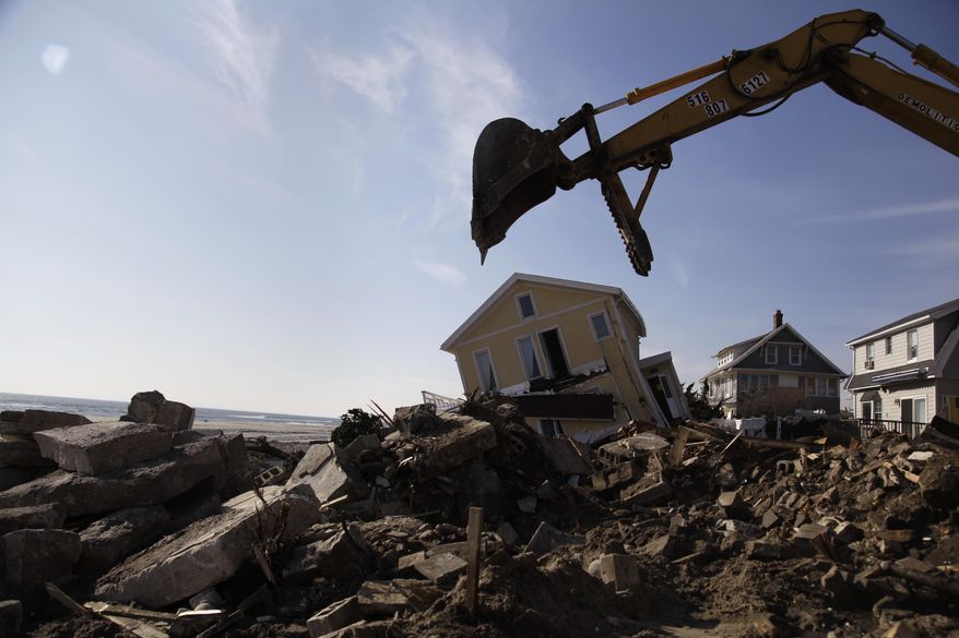 **FILE** Cleanup continues Nov. 29, 2012, on the site of a demolished home on the Rockaway Peninsula in New York. Superstorm Sandy damaged or destroyed 305,000 housing units in New York. (Associated Press)