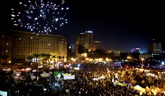 Fireworks burst over Tahrir Square as protesters gather in Cairo on Dec. 4, 2012. Demonstrations by tens of thousands of Egyptians outside the presidential palace turned violent as tensions grew over Islamist President Mohammed Morsi&#39;s seizure of nearly unrestricted powers. Thousands of protesters also gathered in Cairo&#39;s downtown Tahrir Square, miles away from the palace, to join several hundred who have been camping out there for nearly two weeks. (Associated Press)
