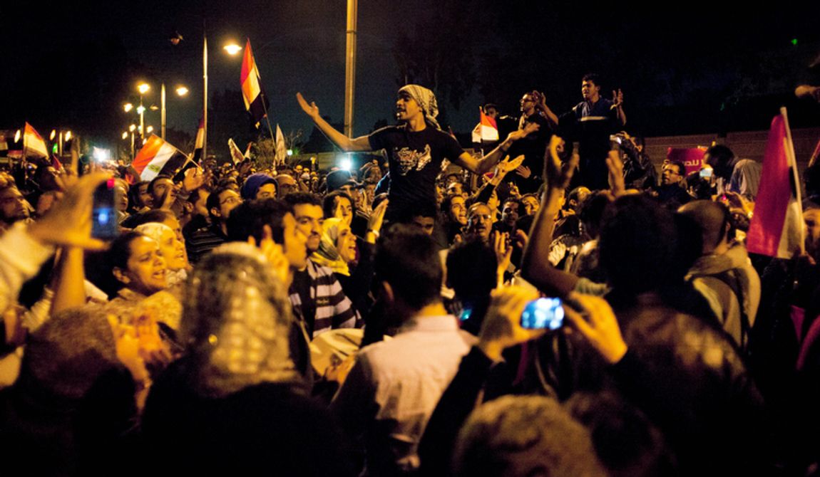 Egyptian protesters chant slogans against the Muslim Brotherhood during a rally Dec. 4, 2012, in front of the presidential palace in Cairo. (Associated Press)