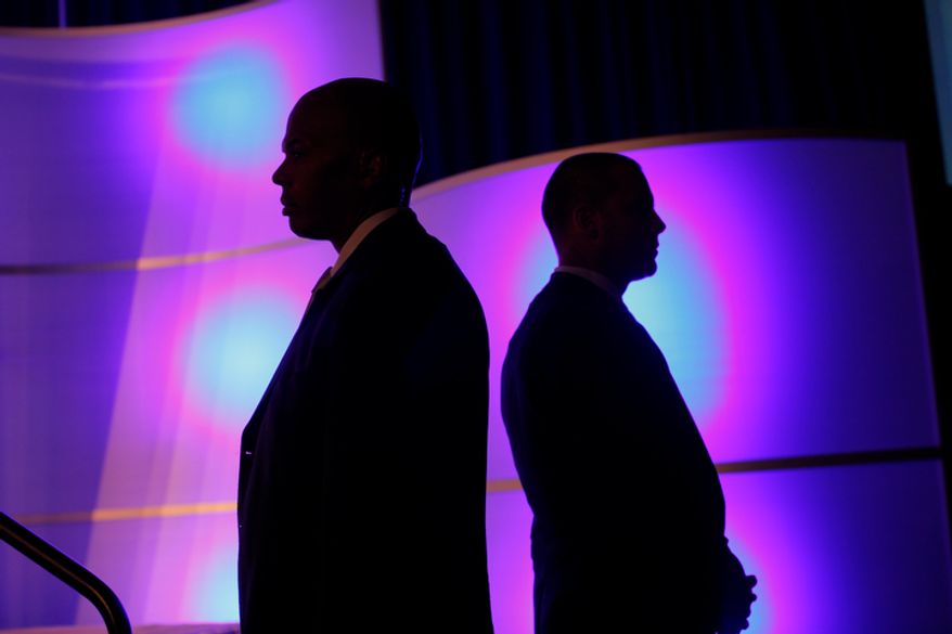 U.S. Secret Service agents stands watch as Republican presidential candidate Mitt Romney addresses the U.S. Hispanic Chamber of Commerce in Los Angeles on Monday, Sept. 17, 2012. (AP Photo/Charles Dharapak)