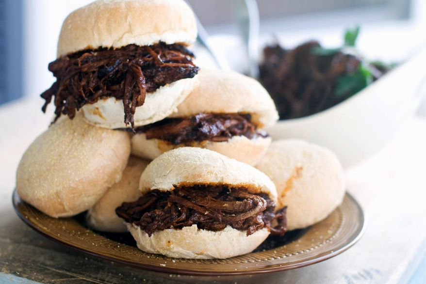 ** FILE ** Sweet-and-tangy barbecue brisket is a delicious filler for sliders. (Associated Press)