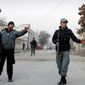 Policemen stand guard near the scene where Afghan intelligence chief Asadullah Khalid was wounded in an assassination attempt in Kabul, Afghanistan, on Thursday, Dec. 6, 2012. (AP Photo/Ahmad Jamshid)