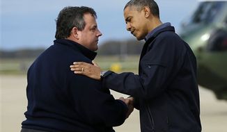 **FILE** President Obama is greeted Oct. 31, 2012, by New Jersey Gov. Chris Christie upon his arrival at Atlantic City International Airport in Atlantic City, N.J. Obama traveled to the region to take an aerial tour of the Atlantic Coast in New Jersey in areas damaged by superstorm Sandy. (Associated Press)