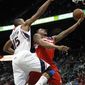 Washington Wizards guard Bradley Beal is fouled as he drives to the basket by Atlanta Hawks center Al Horford (15) in the second half of an NBA basketball game Friday, Dec. 7, 2012, in Atlanta. Atlanta won 104-95. (AP Photo/John Bazemore)