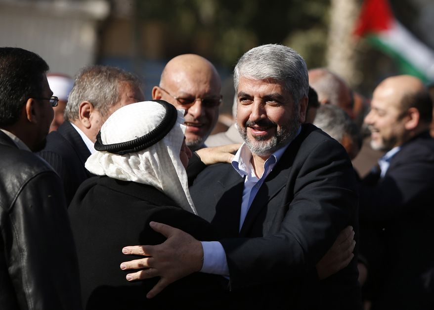 Exiled Hamas chief Khaled Mashaal arrivaes at Rafah crossing in the southern Gaza Strip on Dec. 7, 2012. The exiled chief broke into tears as he arrived in the Gaza Strip for his first-ever visit, a landmark trip reflecting his militant group's growing international acceptance and its defiance of Israel. (Associated Press)